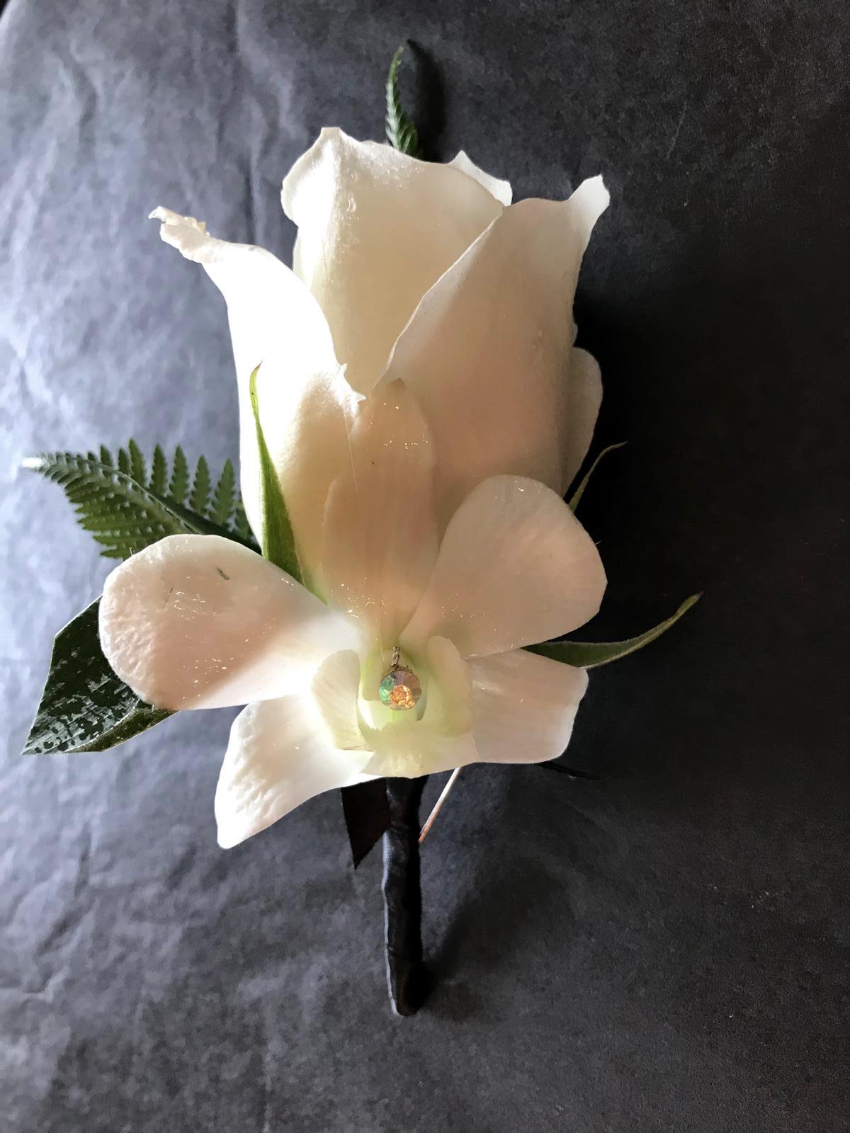 Standard Boutonniere- various rose colours can be chosen, where available. Gemstone is only added if coordinating wrist corsage has been ordered with crystal stones